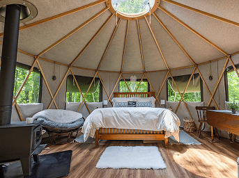 17' yurt interior with bed and table