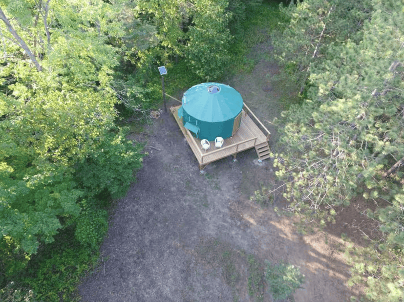 Green yurt from above with deck